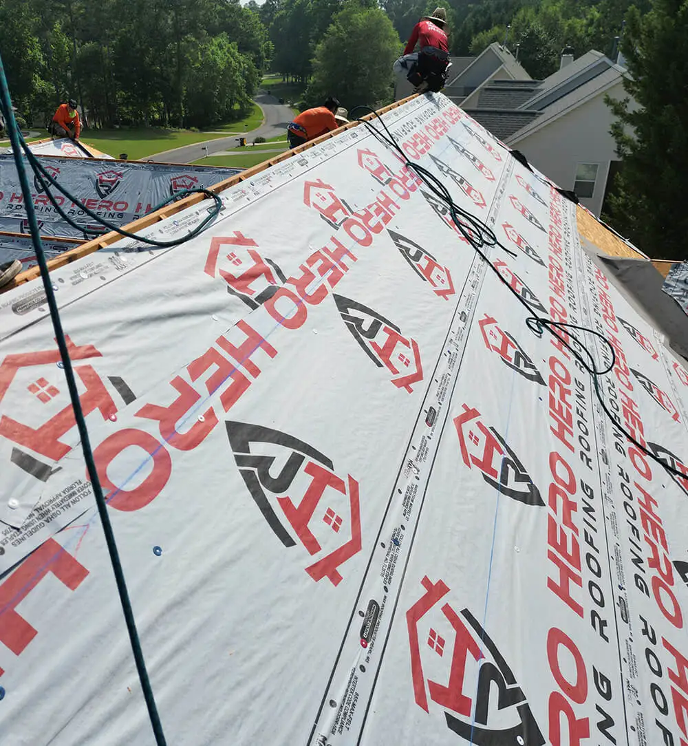a photo of Hero Roofing company roofers on top of a roof