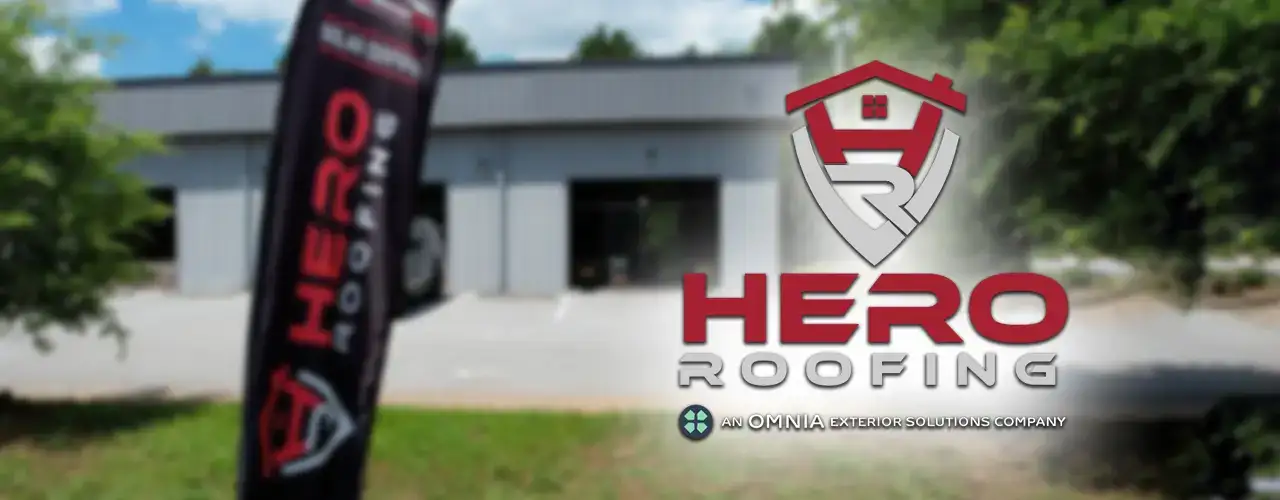 Hero Roofing yard with banner