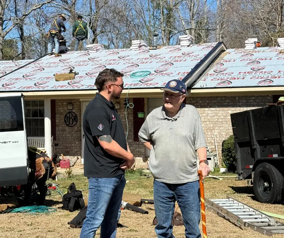 a photo of a Hero roofer with a veteran