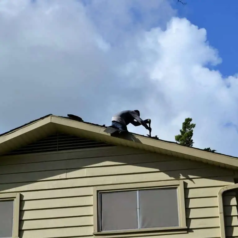 Emergency Roof Repair Marietta Roofing contractor replacing shingles.