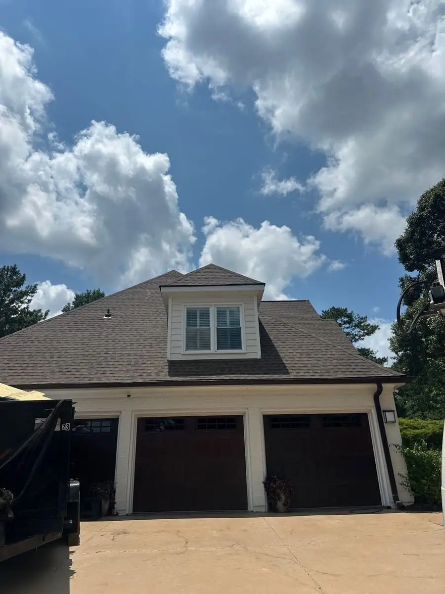 Shingle roof with a dormer above a three-car garage in Peachtree City, GA