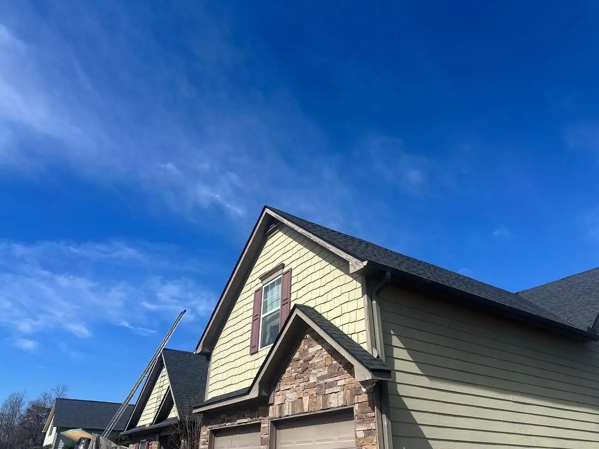 Dark shingle roof on a home with stone accents in Locust Grove, GA