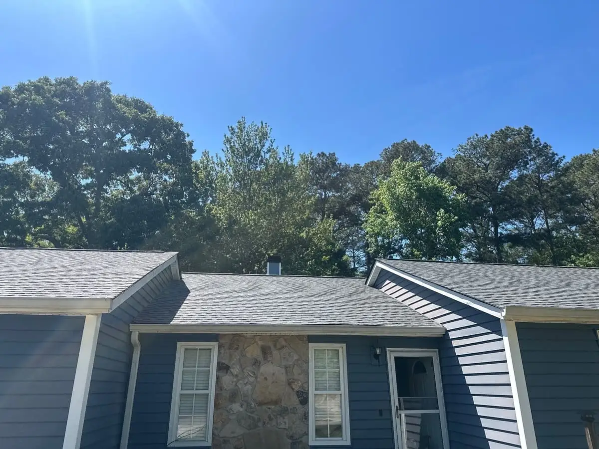Gray shingle roof on a home with stone and blue siding in Riverdale, GA
