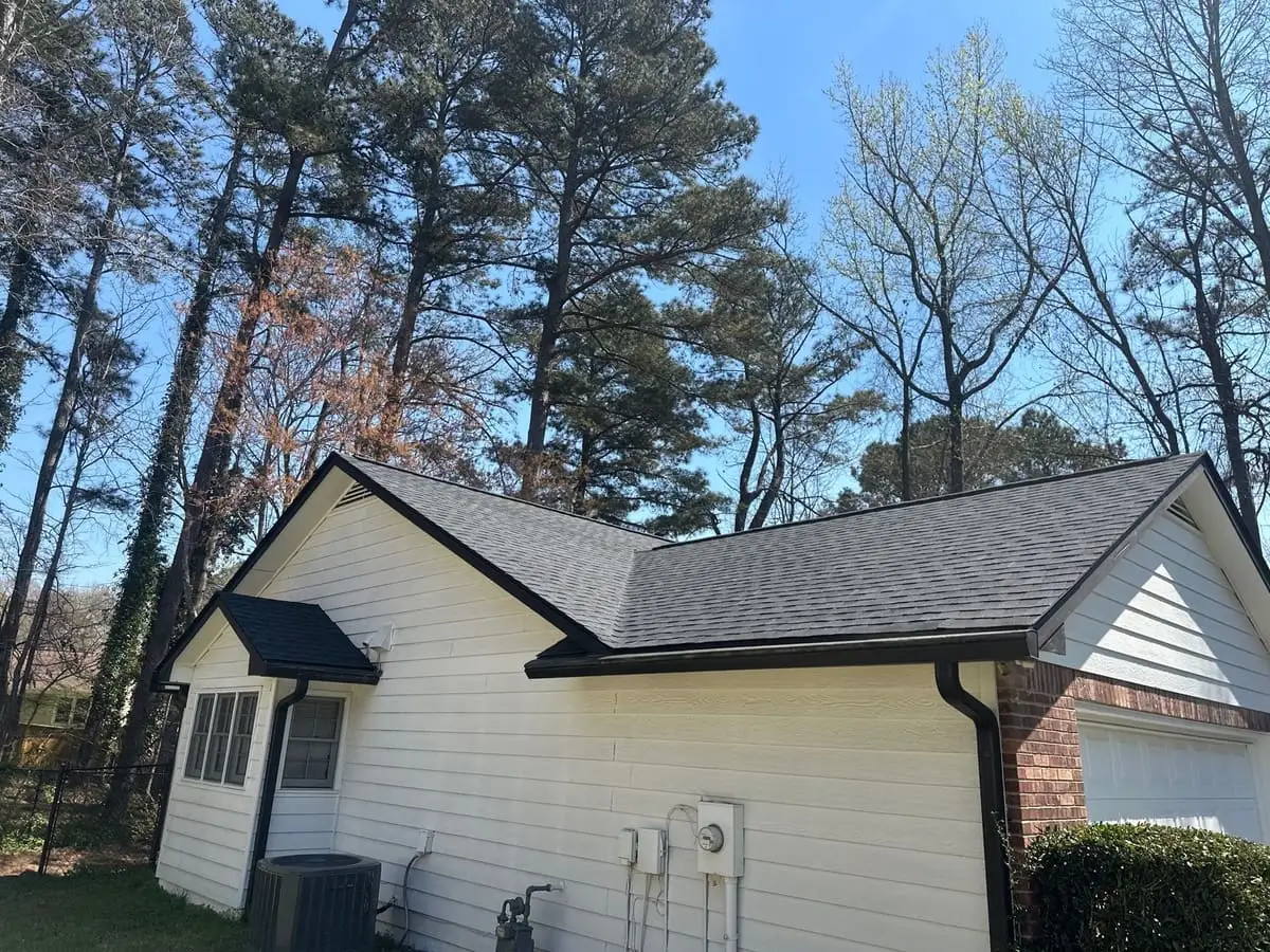 Dark shingle roof on a white single-story home in Hampton, GA