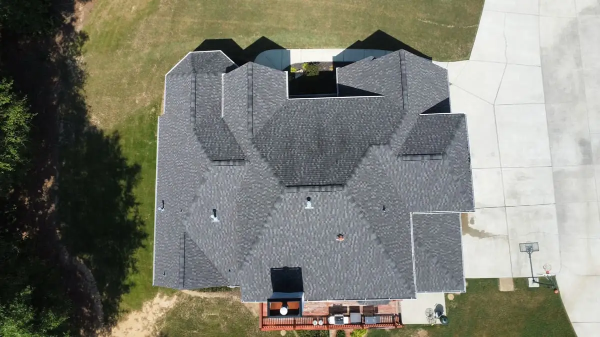 Aerial view of a finished shingle roof on a home in Senoia, GA