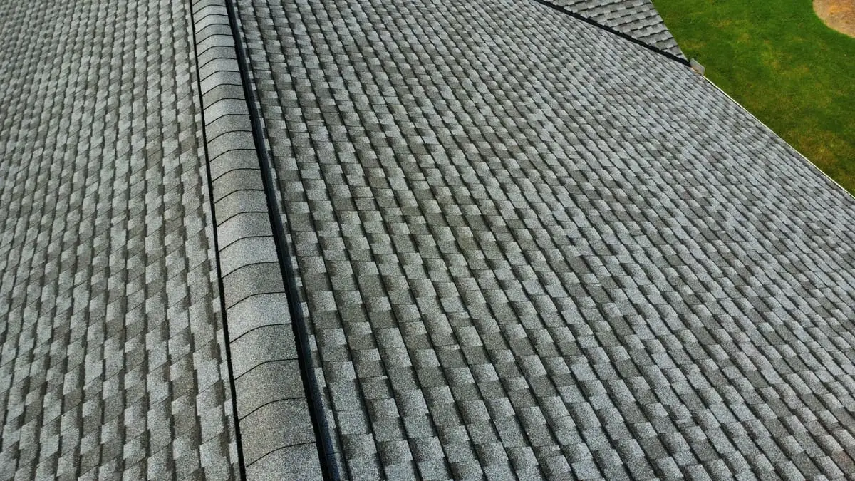 Close view of new architectural shingles along a ridge in Stockbridge, GA